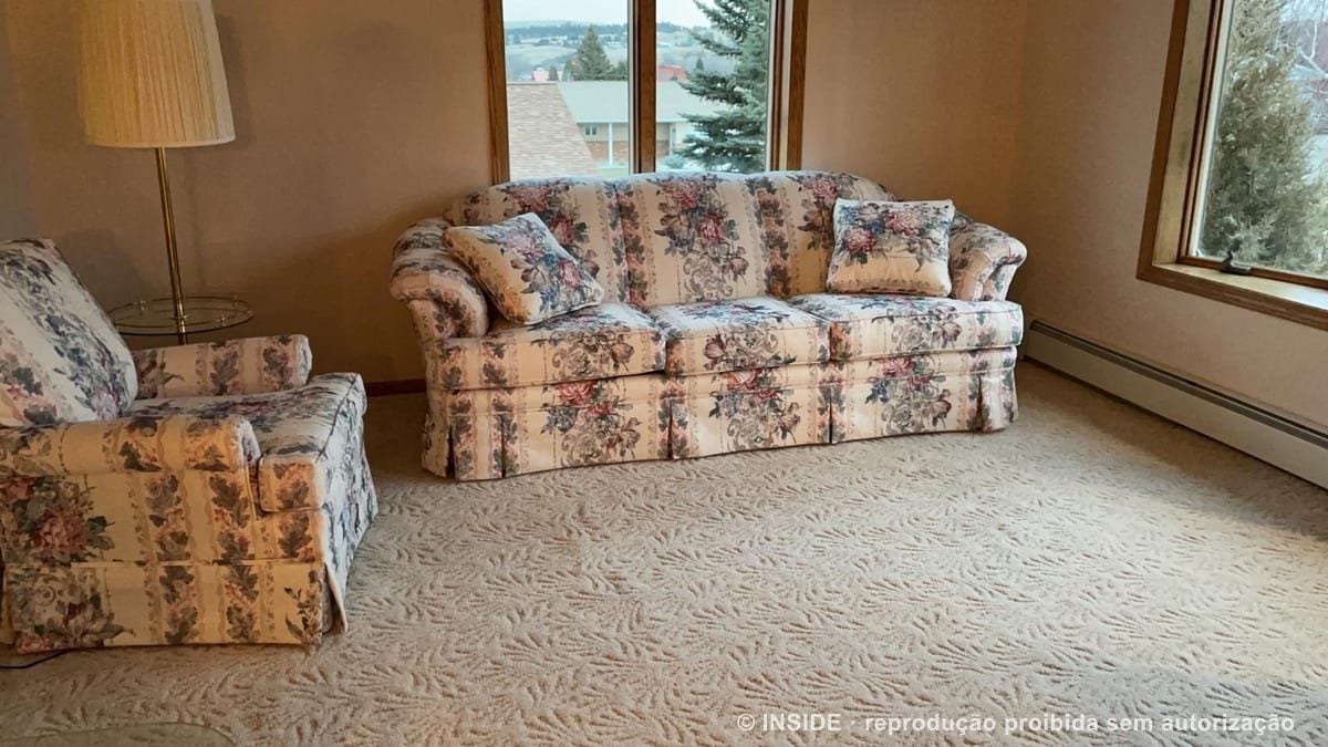 Sitting room with the family's inherited sofas before the project, Montana, USA